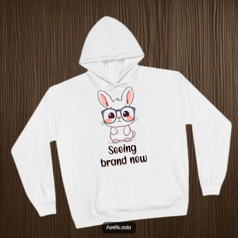 Funny rabbit hoodie featuring a curious rabbit peering through large glasses, offering warmth and a sense of wonder.